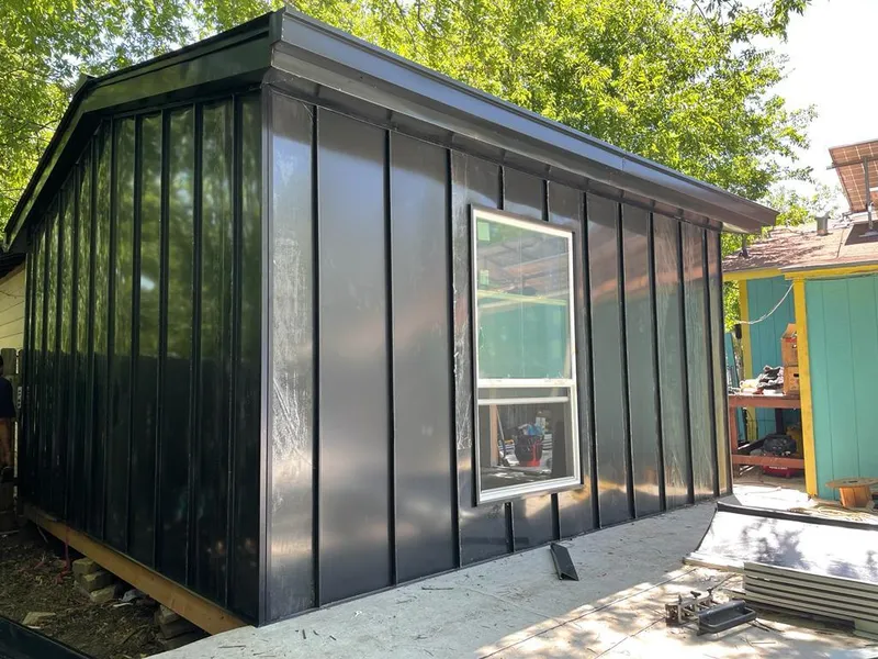 Black standing seam metal wall panels for Metal Roof Installation in Ewing