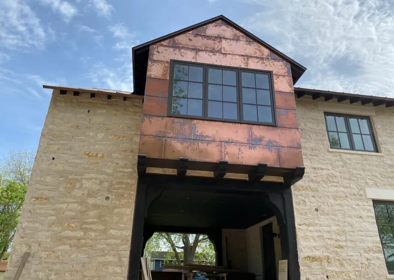 Copper metal panel facade on a stone building for Skylight Installation in Ewing